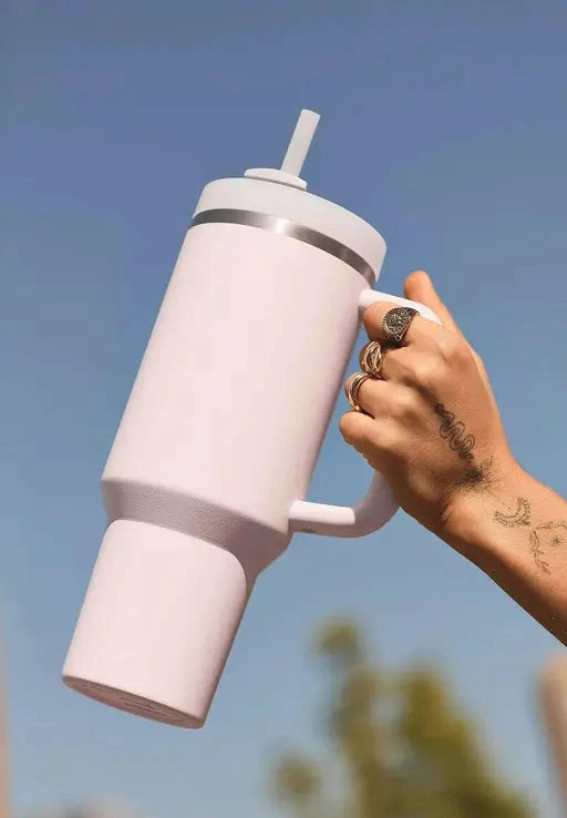 person holding the bitchin' travel mug